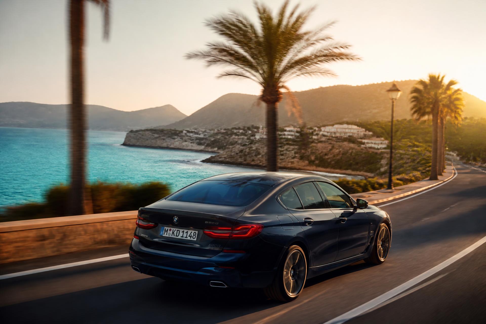 Car driving along the Mallorca coast at sunset